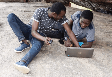 Tunji Ogunoye and Ademola Aderibigbe working on a client project
